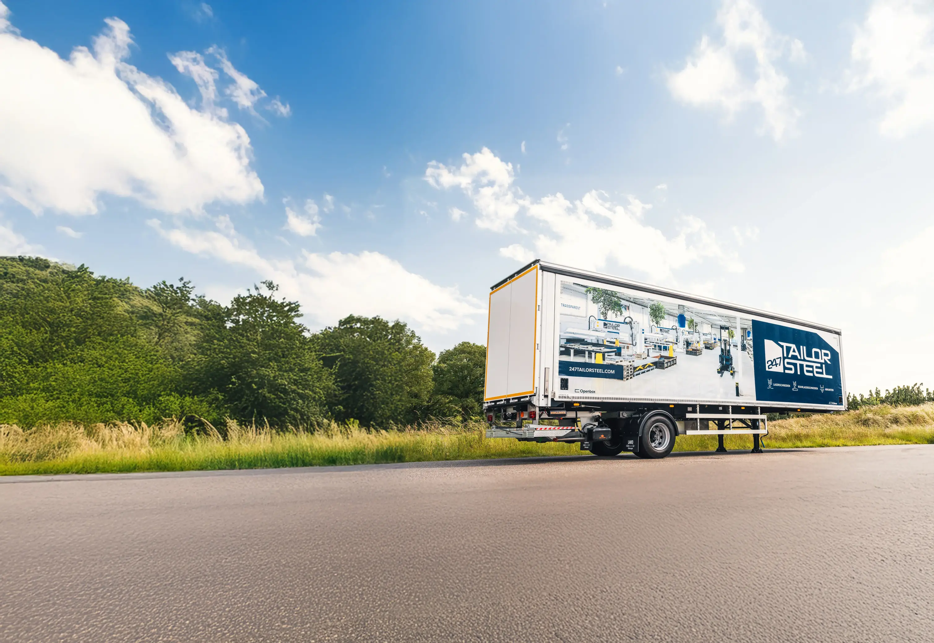DAF tractor and trailer combination with full-length LED side strip running into dusk